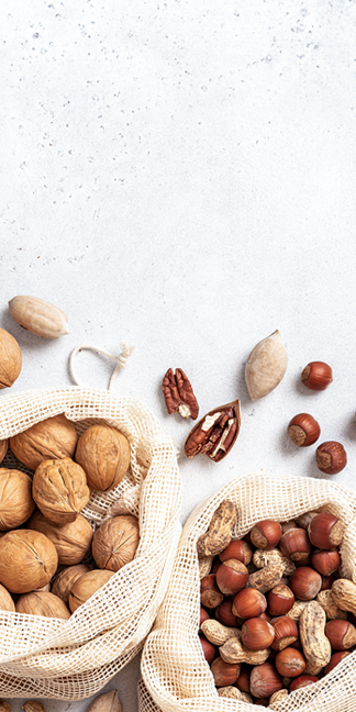 picture have multiple dry fruits such as almond, walnuts, and hazelnuts